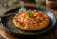 Crumpet s dimljenom paprikom, svježe pečen, zlatnosmeđe vanjštine