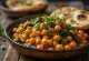 Chana masala sa špinatom, poslužena sa svježim korijanderom